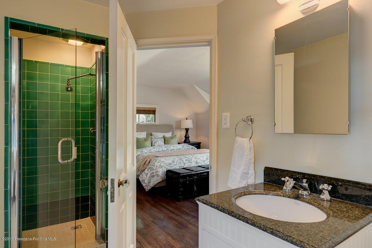 721 Madre Street Pasadena, CA 91107 - Photo 52 of 82 a en suite bathroom with a granite countertop sink and a mirror