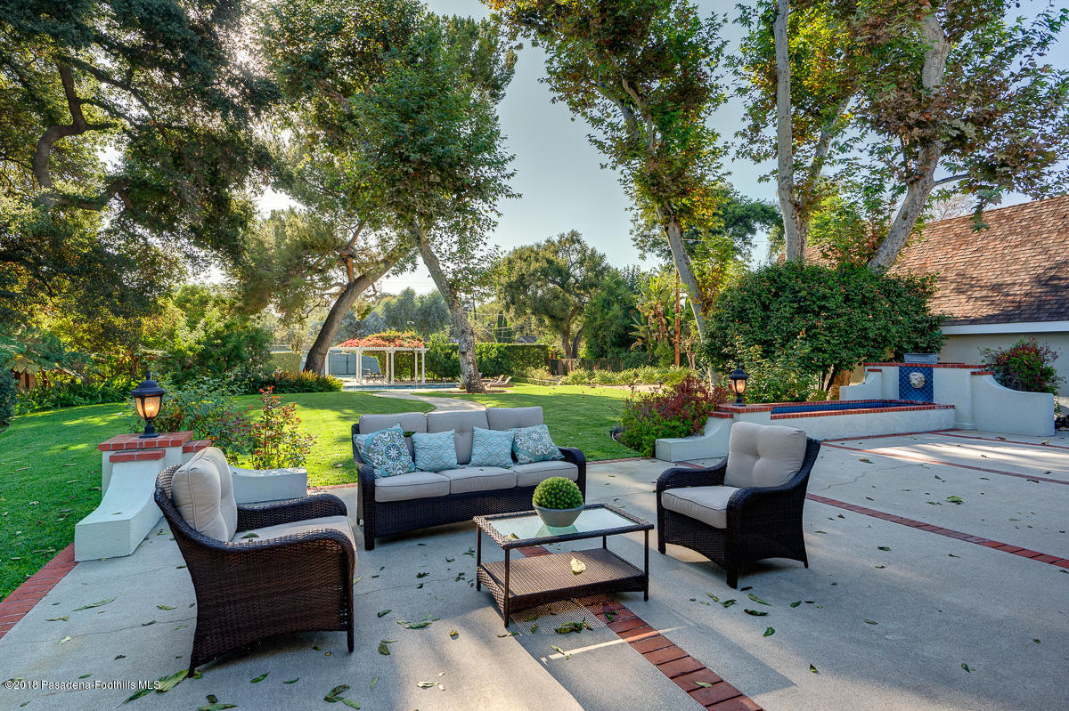 721 Madre Street Pasadena, CA 91107 - Photo 54 of 82 a view of a patio with couches chairs and a fire pit