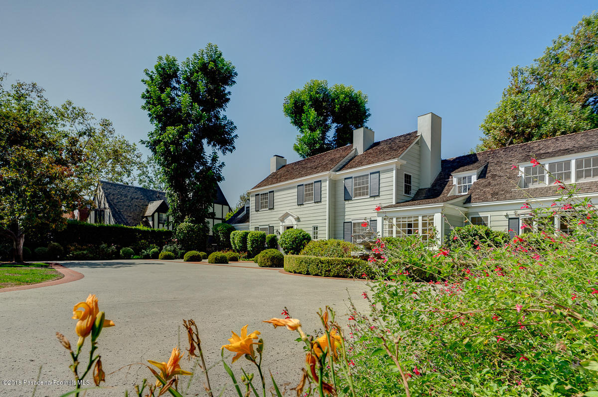 721 Madre Street Pasadena, CA 91107 - Photo 6 of 82 a front view of a house with a yard and a garage