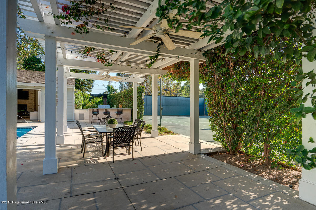 721 Madre Street Pasadena, CA 91107 - Photo 73 of 82 a view of a patio with table and chairs potted plants with floor to ceiling window and potted plants