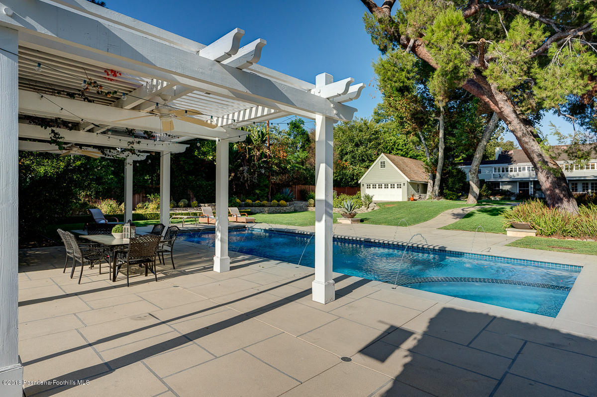 721 Madre Street Pasadena, CA 91107 - Photo 78 of 82 a view of a patio with table and chairs potted plants with wooden floor and fence