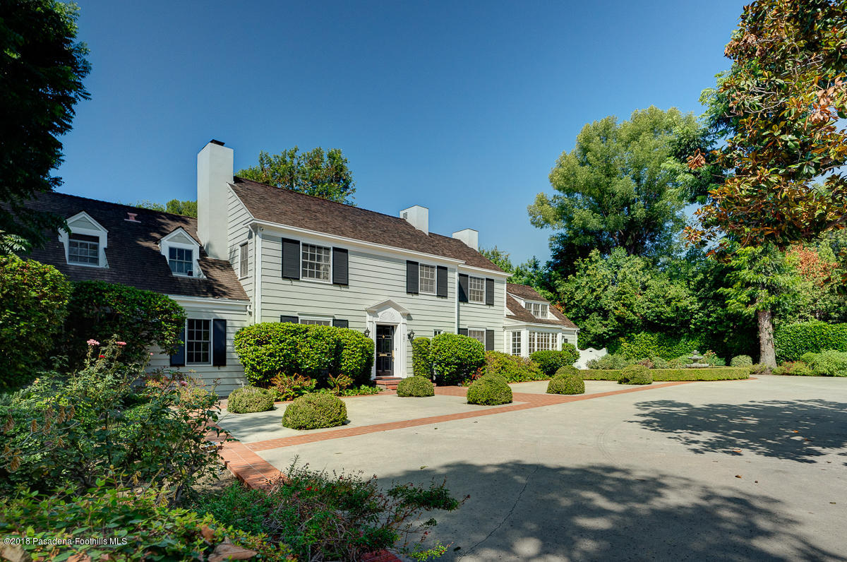721 Madre Street Pasadena, CA 91107 - Photo 9 of 82 a front view of a house with a yard and a garage