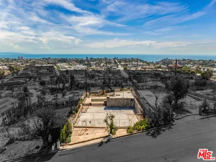 an aerial view of a house with a garden