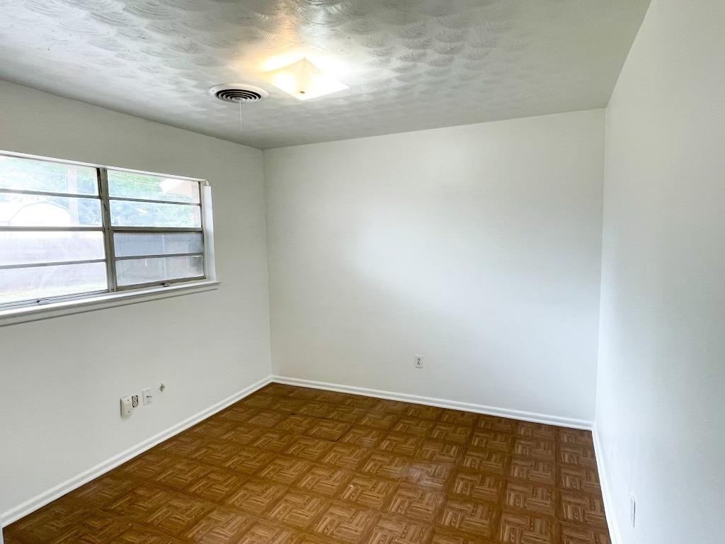 5503 36th Street Lubbock, TX 79407 - Photo 12 of 15 an empty room with windows