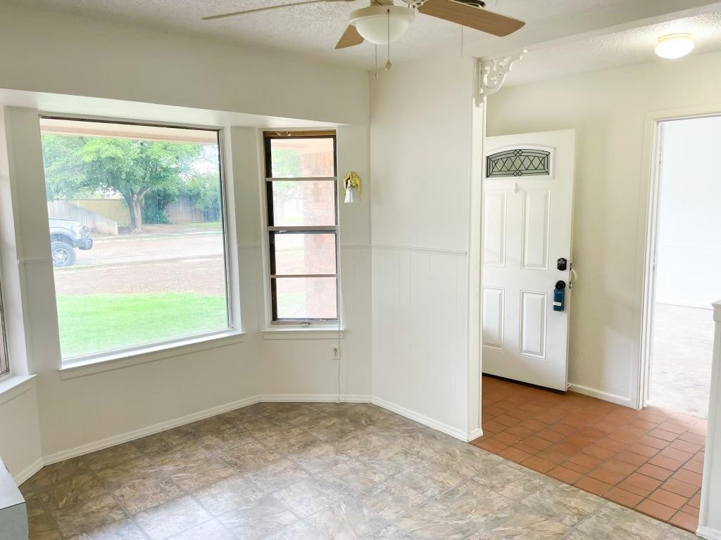 5503 36th Street Lubbock, TX 79407 - Photo 4 of 15 a view of an empty room with a window