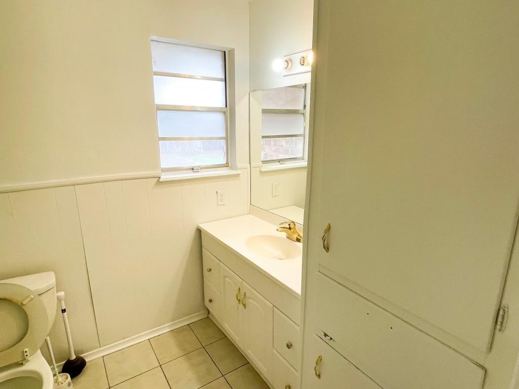 5503 36th Street Lubbock, TX 79407 - Photo 10 of 15 a bathroom with a sink a toilet and shower