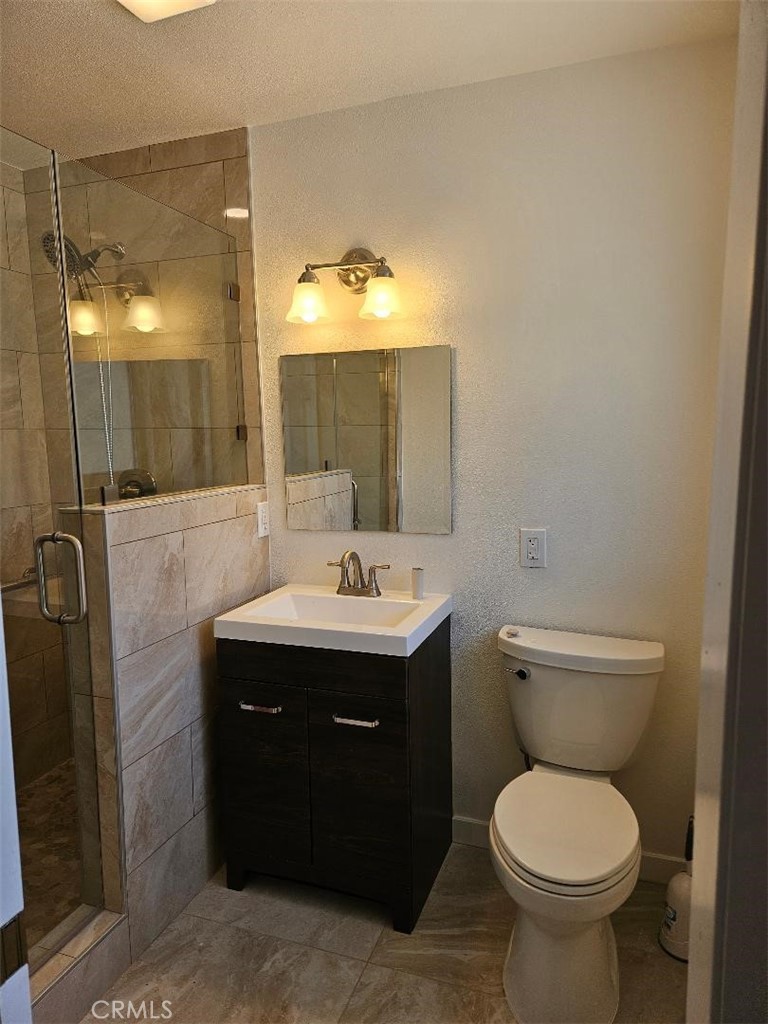 12627 Longleaf Drive La Mirada, CA 90638 - Photo 13 of 19 a bathroom with a toilet sink and mirror