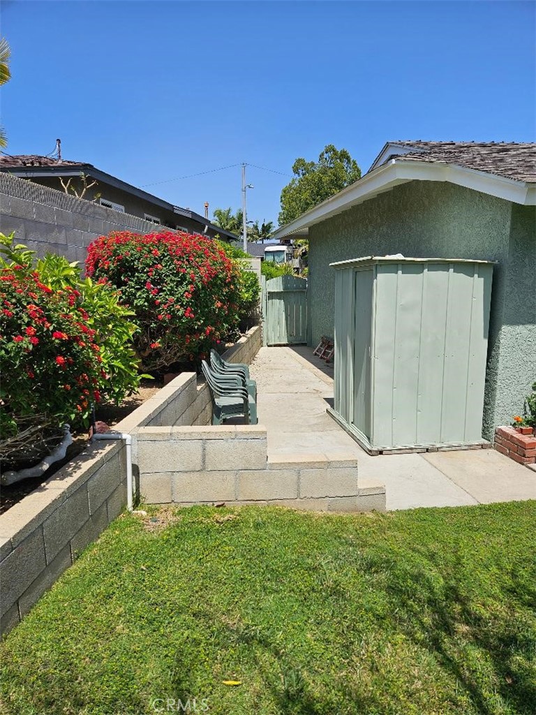 12627 Longleaf Drive La Mirada, CA 90638 - Photo 17 of 19 a front view of a house with a garden