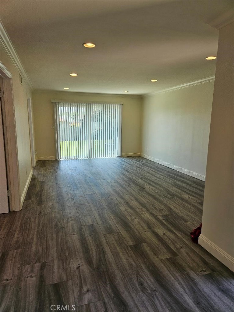 12627 Longleaf Drive La Mirada, CA 90638 - Photo 4 of 19 a view of an empty room with wooden floor and a window