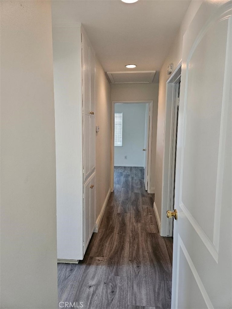12627 Longleaf Drive La Mirada, CA 90638 - Photo 8 of 19 a view of a hallway with wooden floor and a bathroom