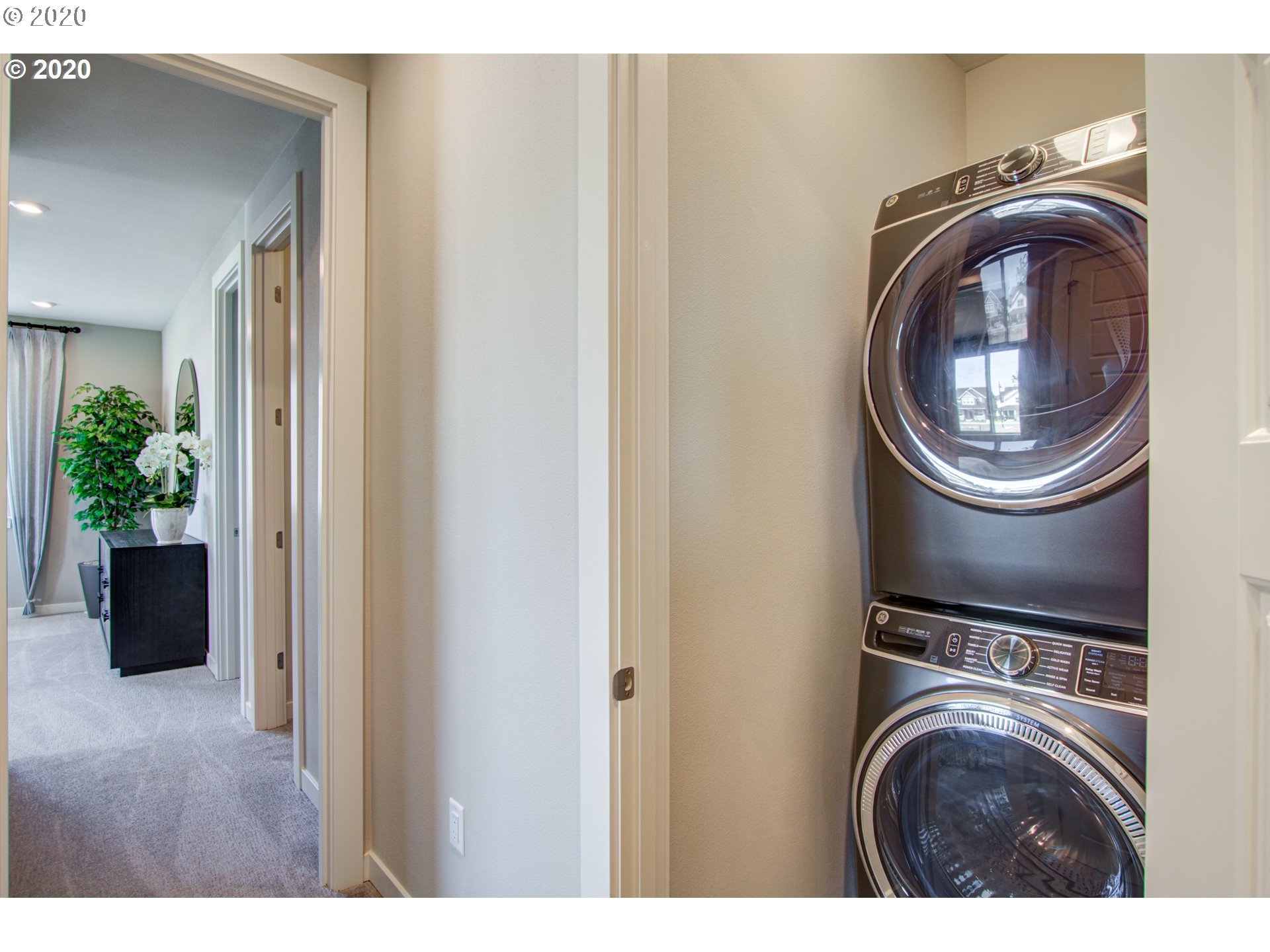 8247 Southeast Kinnaman Road Hillsboro, OR 97123 - Photo 12 of 26 a view of storage and utility room with washer and dryer
