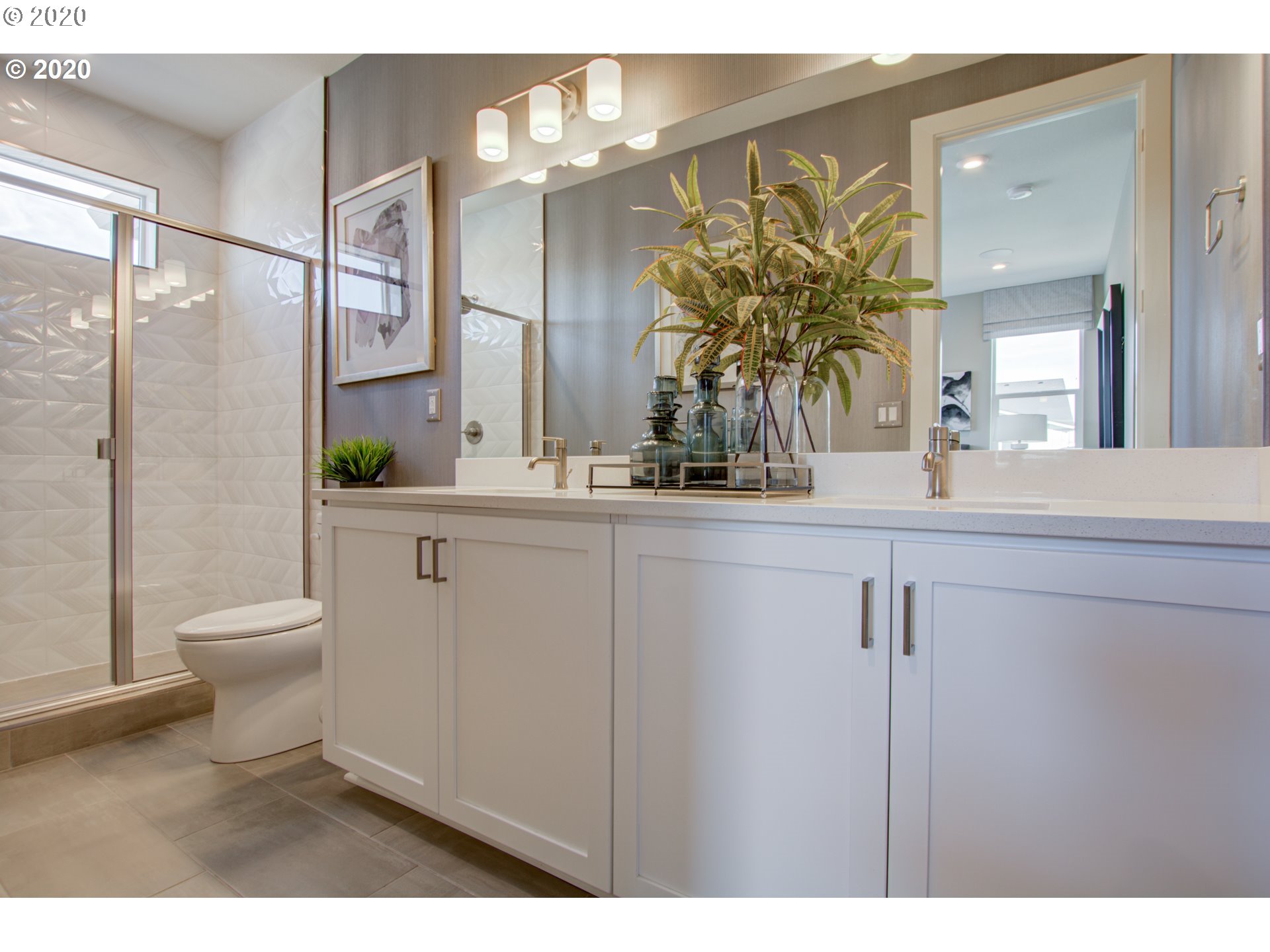 8247 Southeast Kinnaman Road Hillsboro, OR 97123 - Photo 16 of 26 a bathroom with a sink a toilet and a large mirror