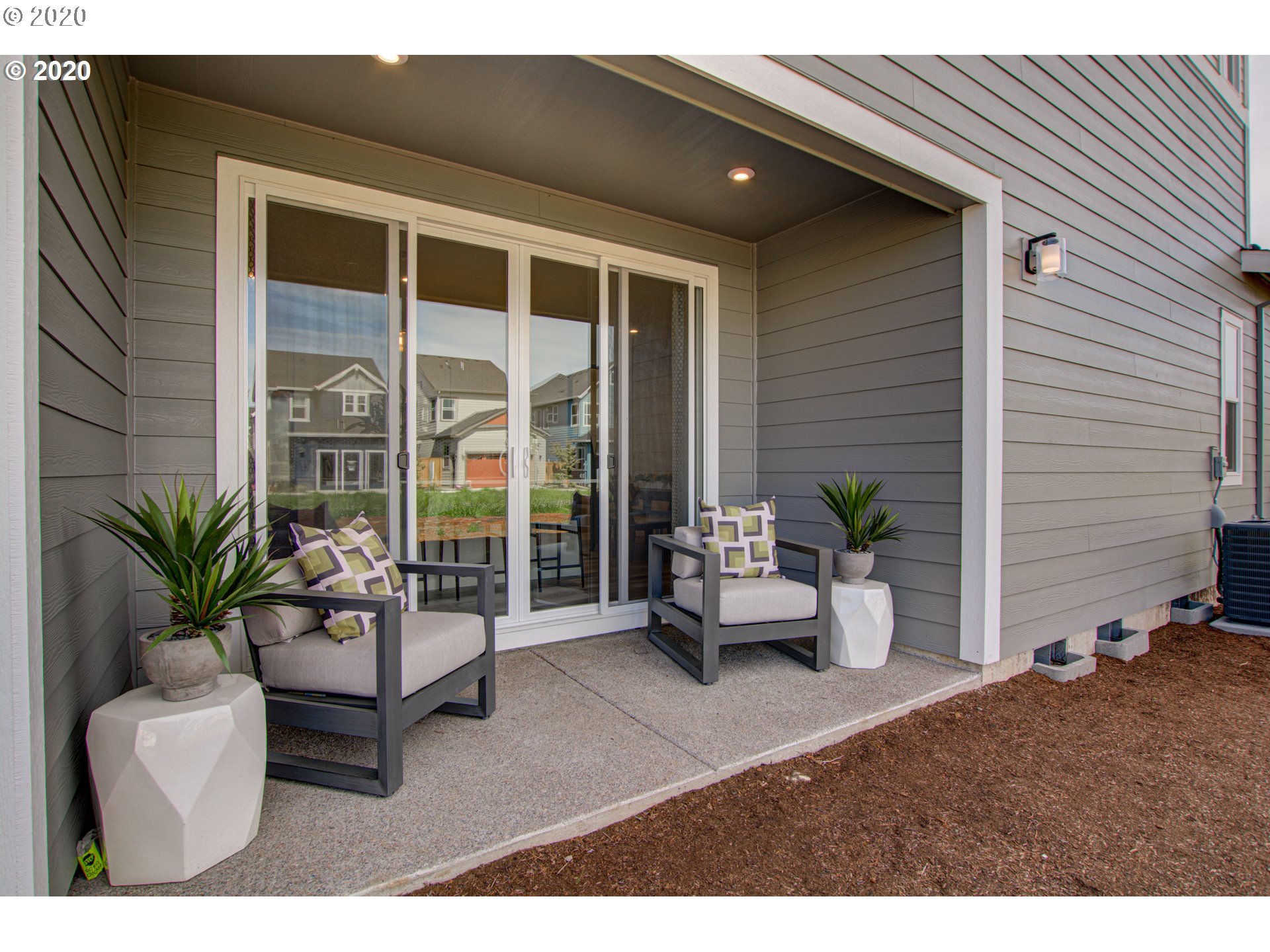 8247 Southeast Kinnaman Road Hillsboro, OR 97123 - Photo 17 of 26 a building outdoor space with patio furniture
