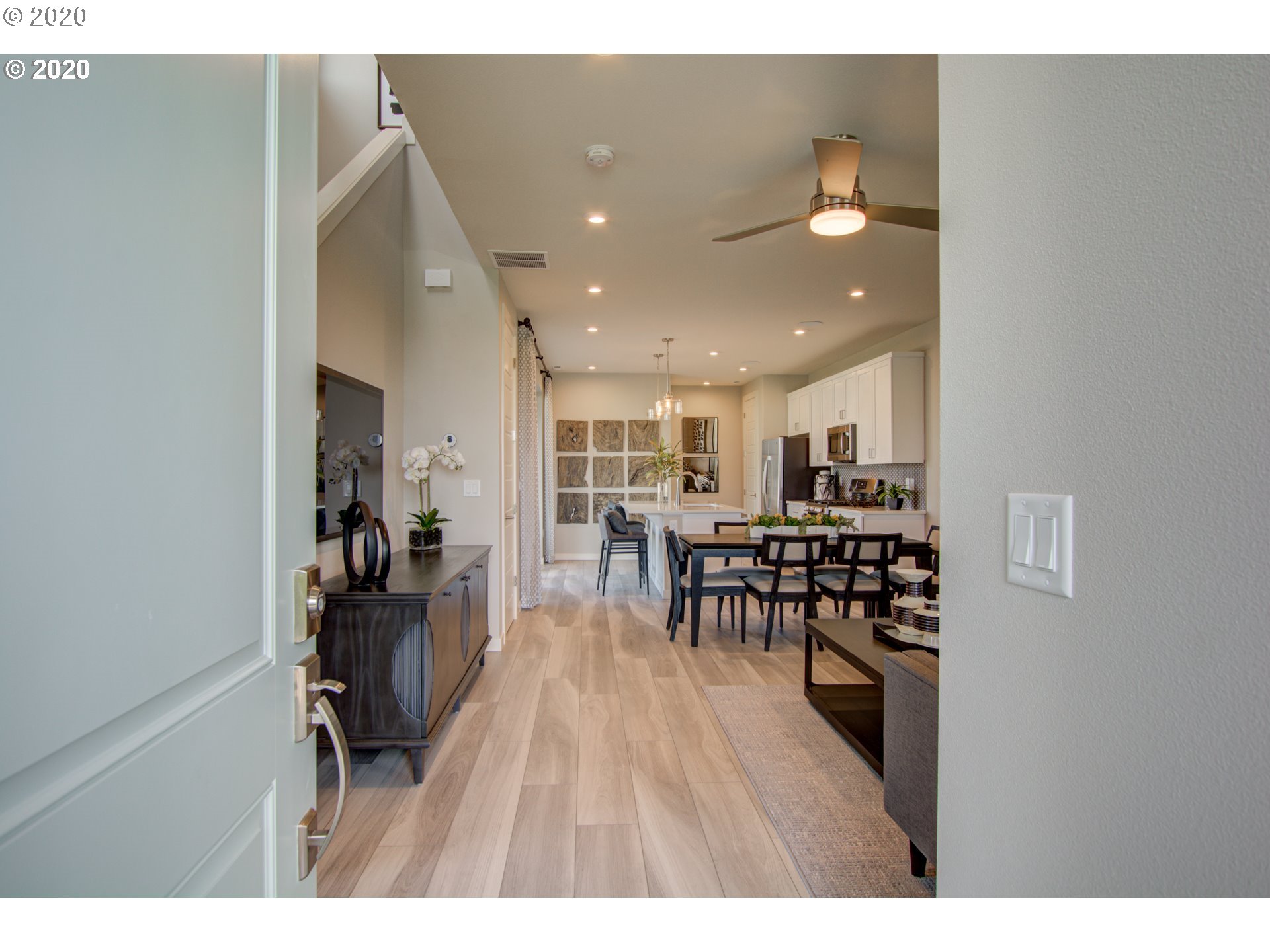8247 Southeast Kinnaman Road Hillsboro, OR 97123 - Photo 20 of 26 a open kitchen with dining room and wooden floor