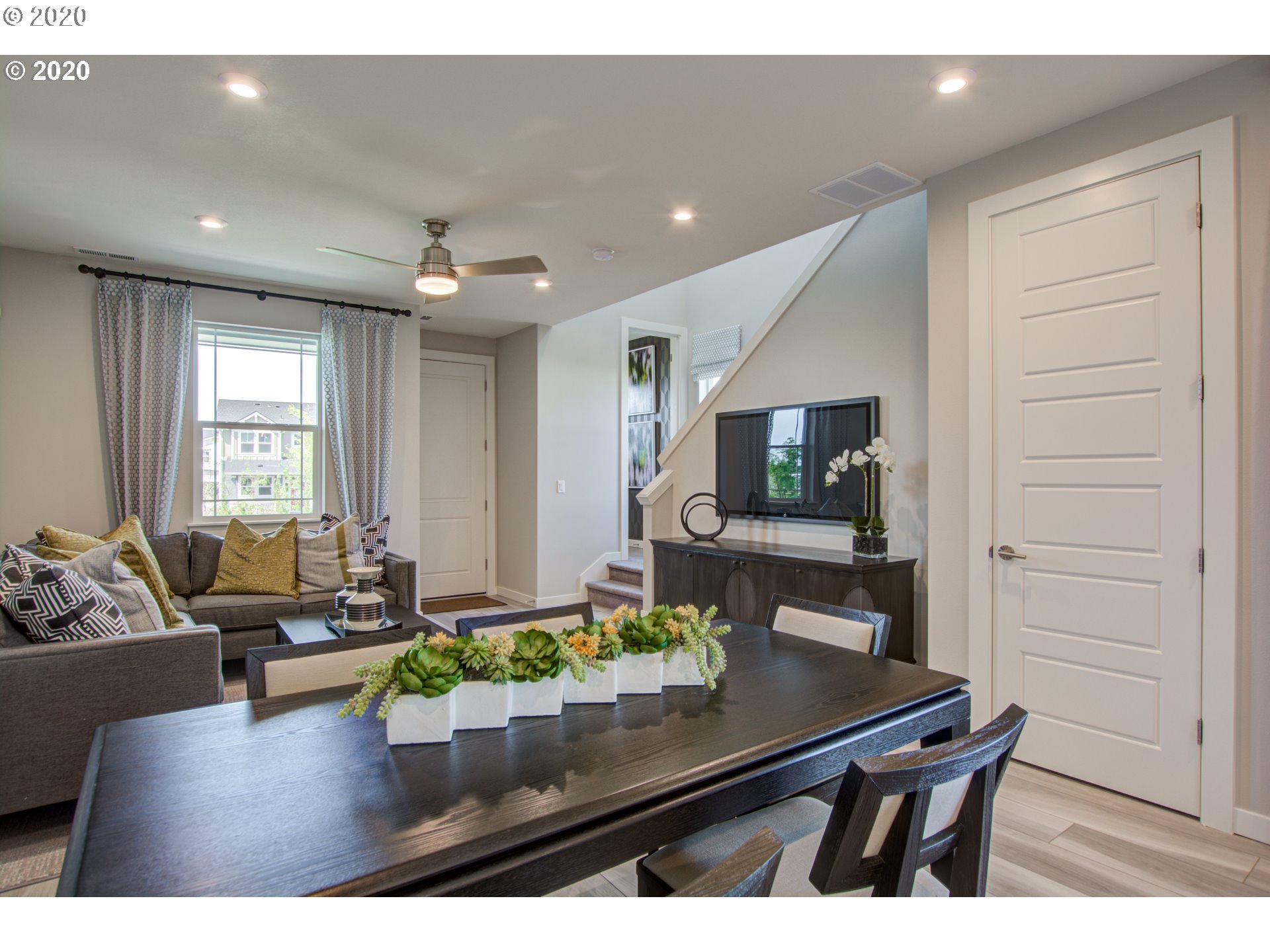8247 Southeast Kinnaman Road Hillsboro, OR 97123 - Photo 24 of 26 a living room with furniture and a flat screen tv