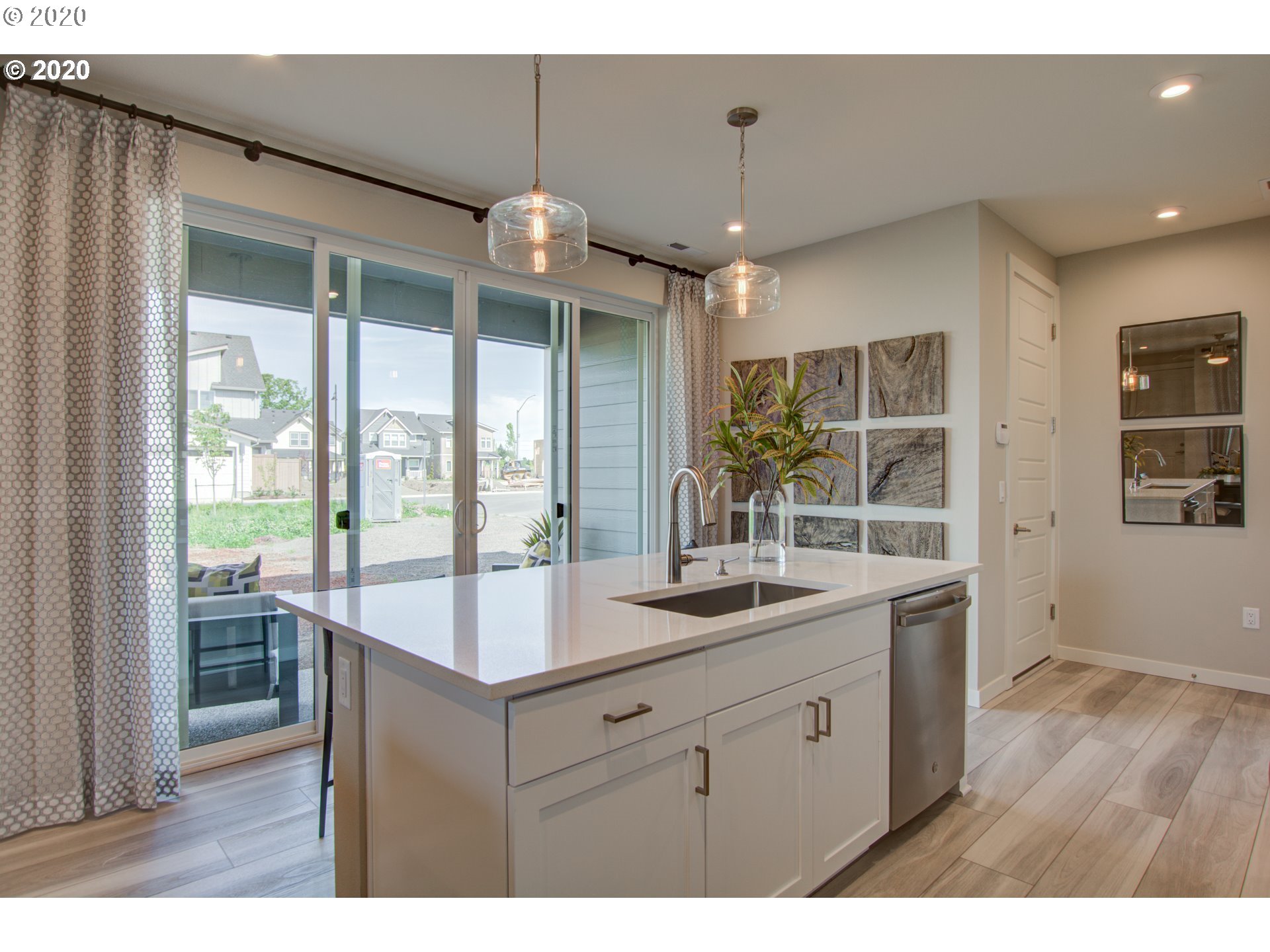 8247 Southeast Kinnaman Road Hillsboro, OR 97123 - Photo 25 of 26 a kitchen with a counter space a sink and appliances