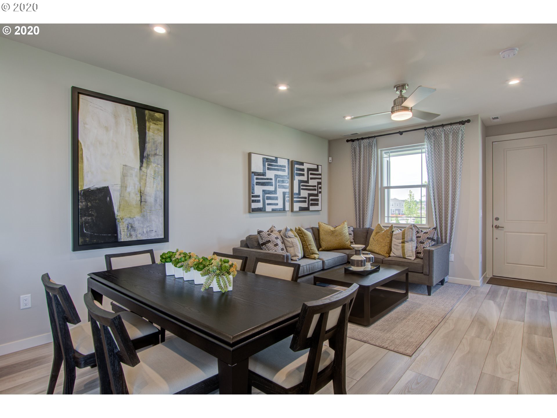 8247 Southeast Kinnaman Road Hillsboro, OR 97123 - Photo 4 of 26 a view of a dining room with furniture and wooden floor