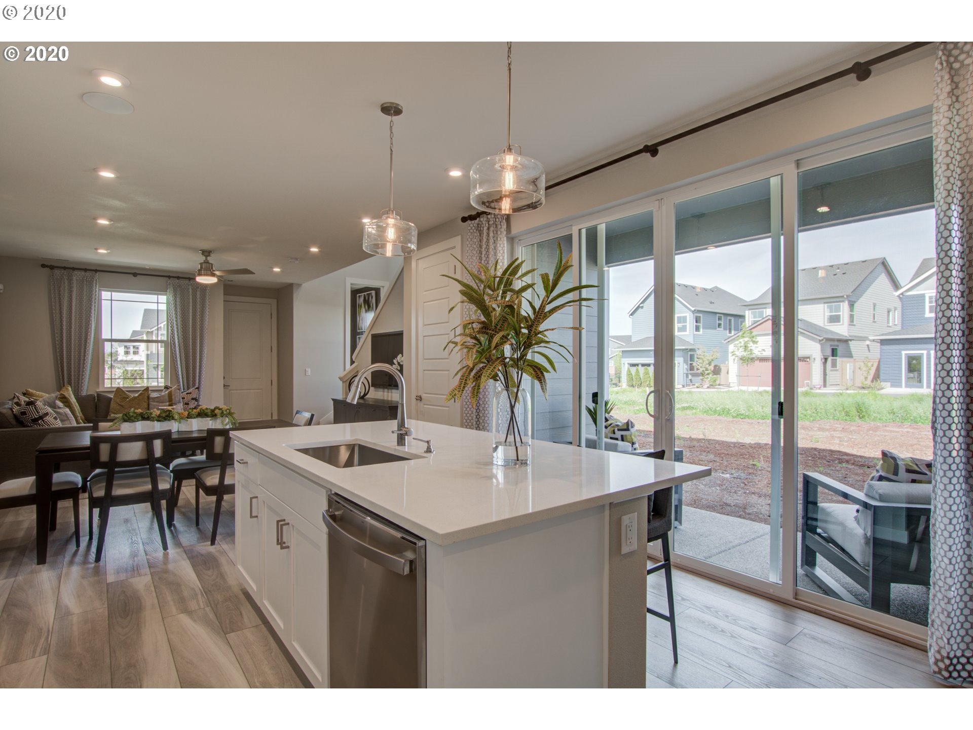 8247 Southeast Kinnaman Road Hillsboro, OR 97123 - Photo 6 of 26 a kitchen with a table chairs stove and granite counter top