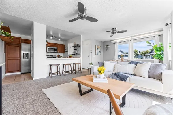 a living room with furniture and a rug