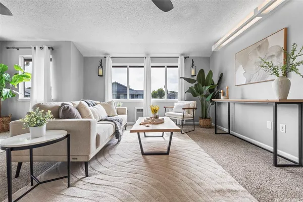 a living room with furniture and a table