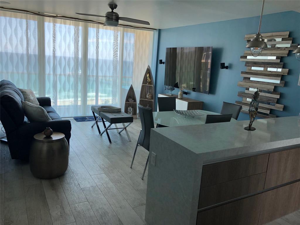 333 Northeast 21st Avenue, Unit 1216 Deerfield Beach, FL 33441 - Photo 16 of 19 a living room with furniture and large windows