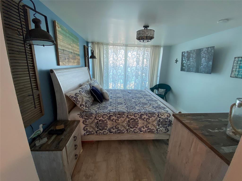 333 Northeast 21st Avenue, Unit 1216 Deerfield Beach, FL 33441 - Photo 3 of 19 a bed sitting in a bedroom next to a window