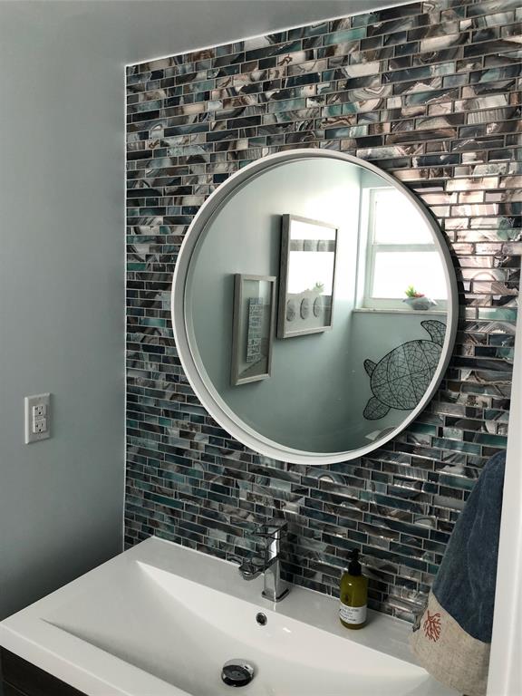 333 Northeast 21st Avenue, Unit 1216 Deerfield Beach, FL 33441 - Photo 9 of 19 closeup of a sink with a vanity