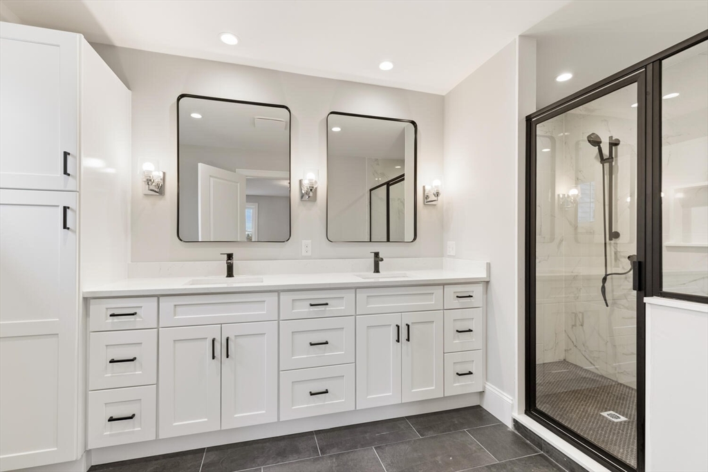 88 Hillcrest Road Waltham, MA 02451 - Photo 24 of 39 a spacious bathroom with double vanity a mirror a shower and a sink