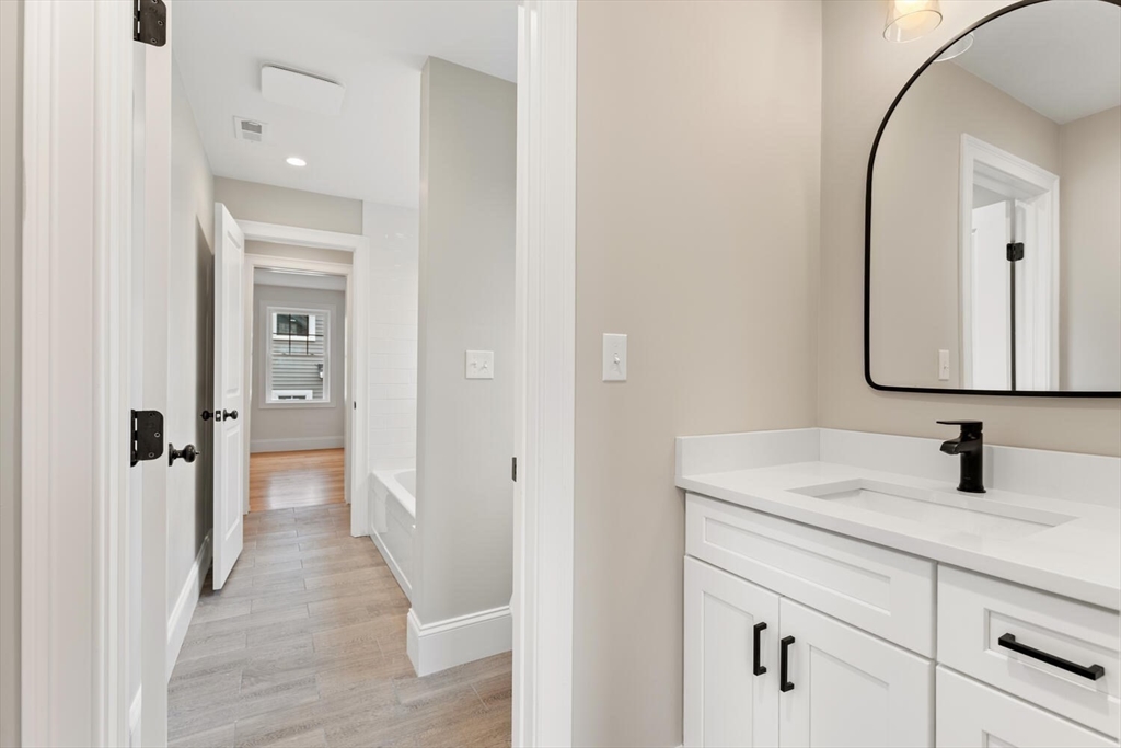 88 Hillcrest Road Waltham, MA 02451 - Photo 29 of 39 a bathroom with a sink and a mirror