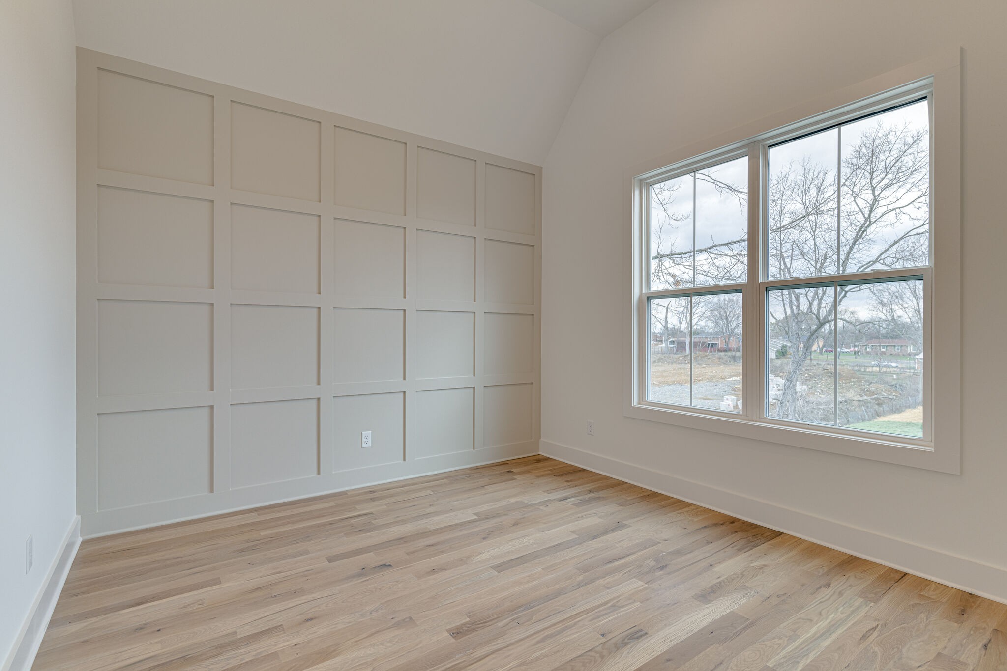 1206 Apache Lane Madison, TN 37115 - Photo 14 of 39 an empty room with wooden floor and windows