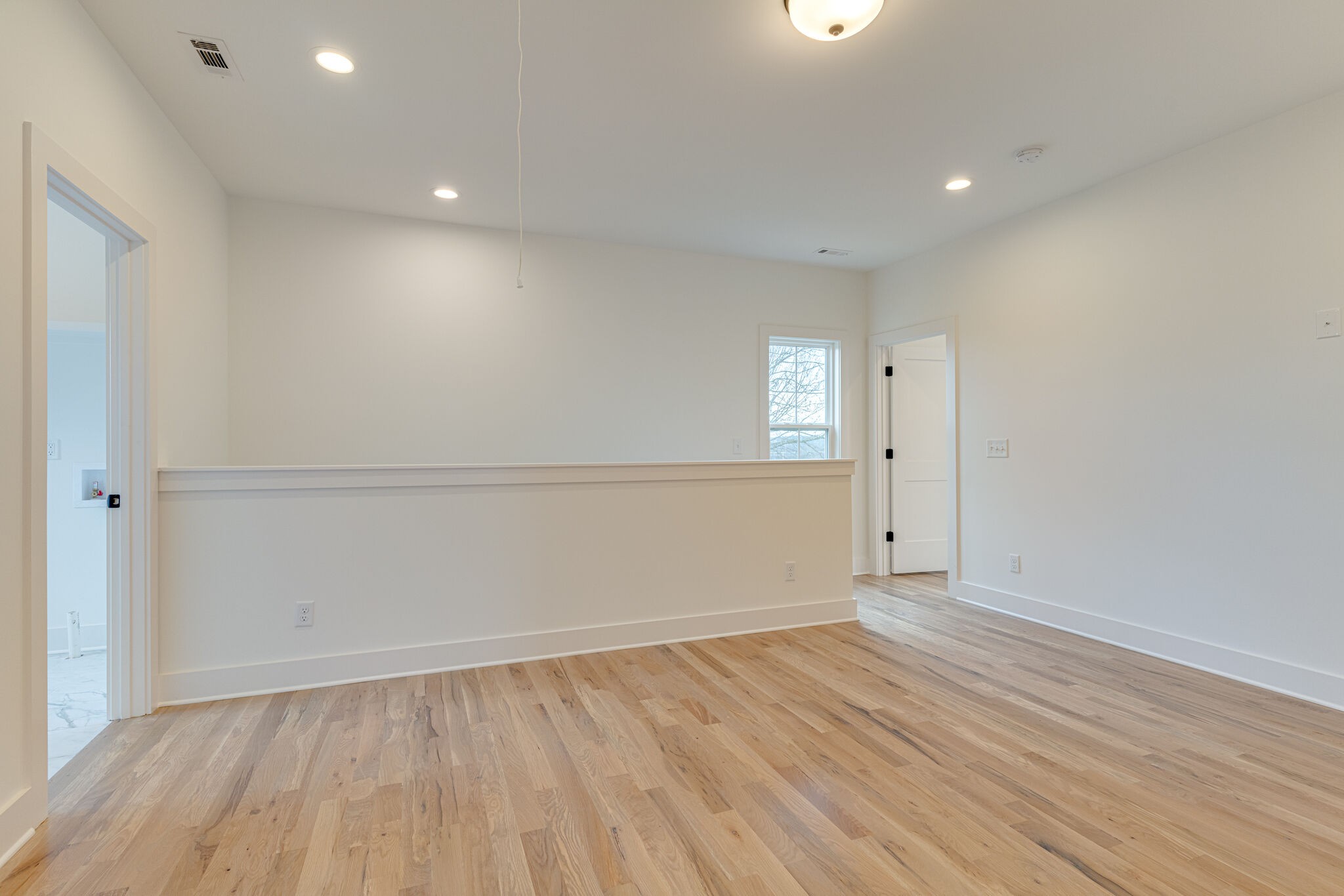 1206 Apache Lane Madison, TN 37115 - Photo 17 of 39 an empty room with wooden floor & windows