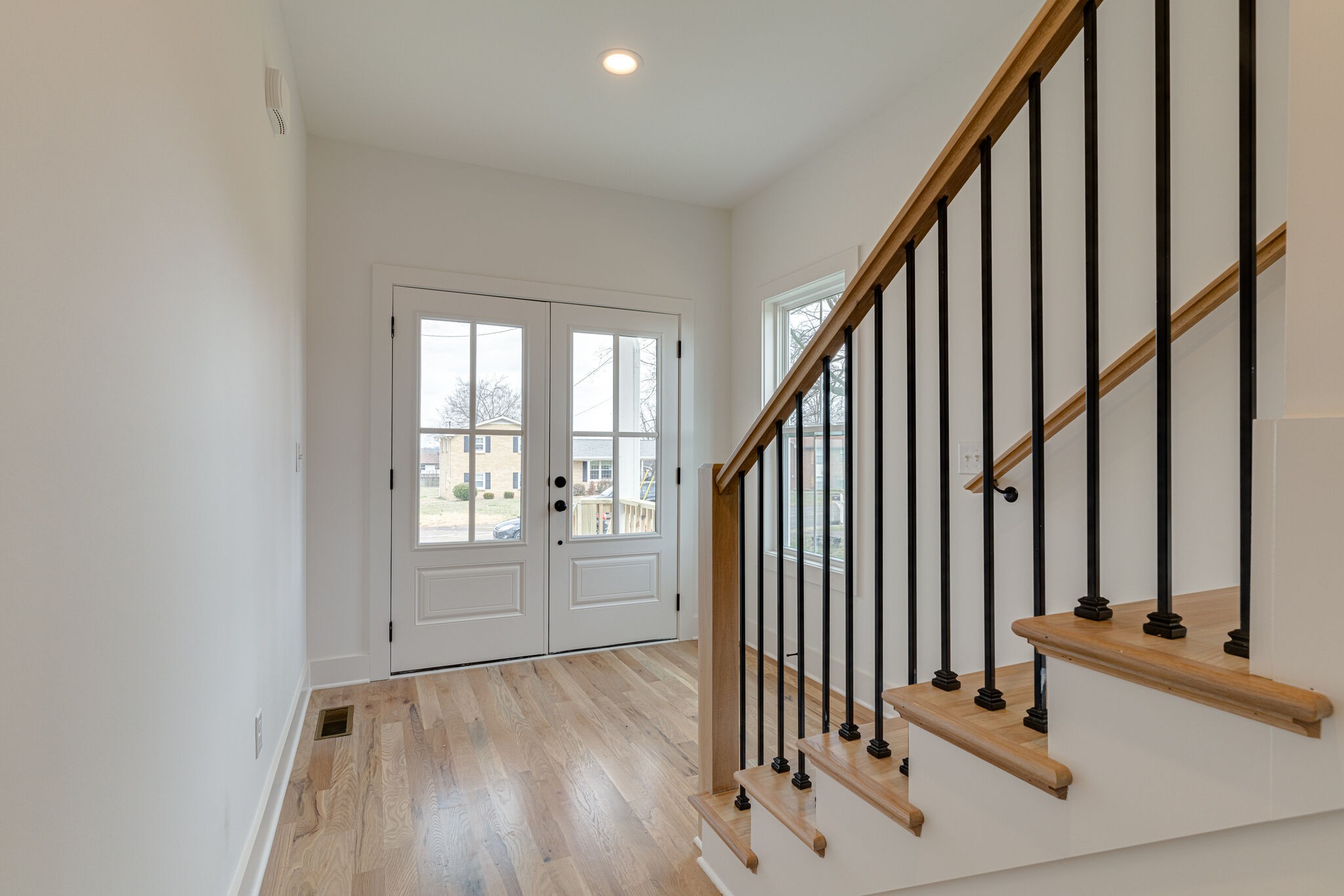 1206 Apache Lane Madison, TN 37115 - Photo 26 of 39 an entryway with wooden floor and stairs