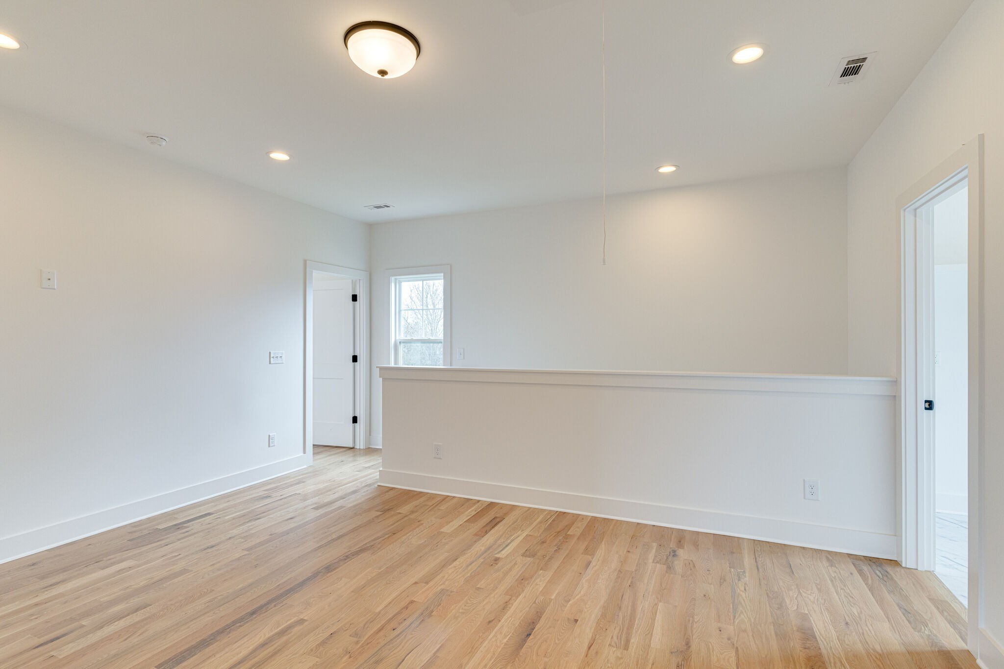 1206 Apache Lane Madison, TN 37115 - Photo 34 of 39 an empty room with wooden floor and windows