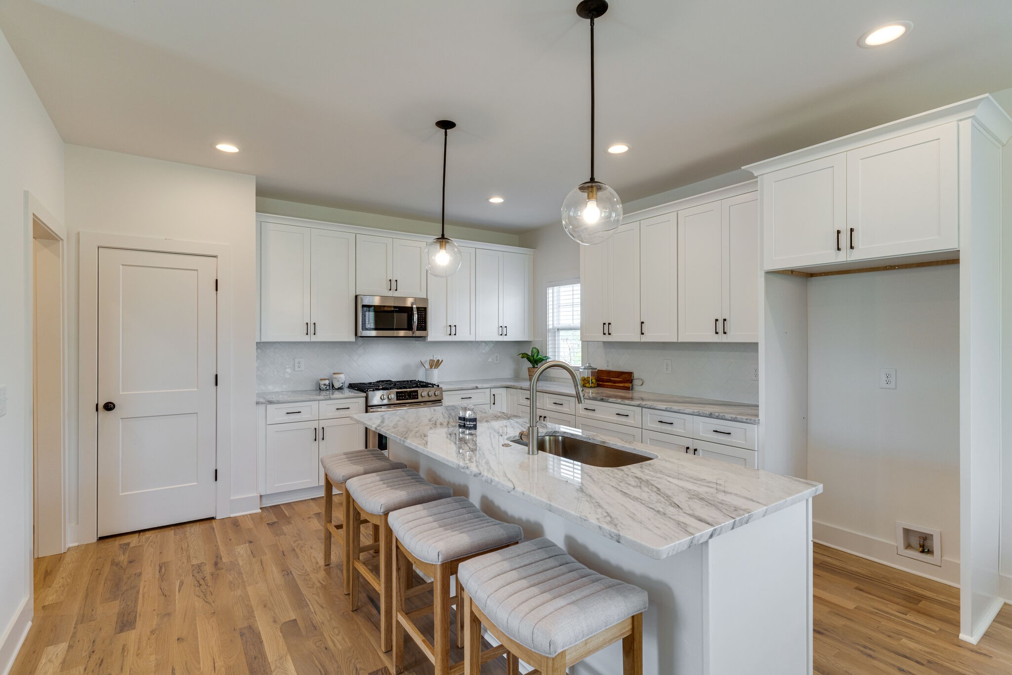 1206 Apache Lane Madison, TN 37115 - Photo 8 of 39 a kitchen with a sink a stove a refrigerator and white cabinets