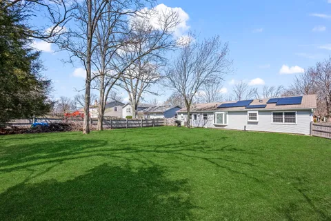 a view of a house with backyard