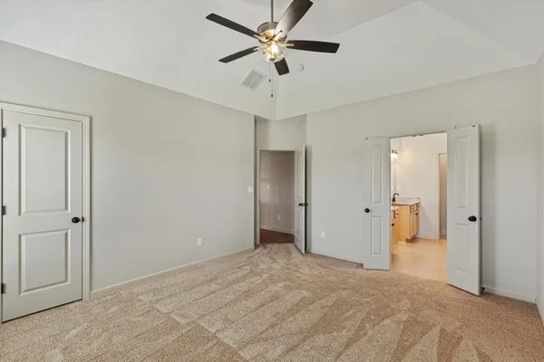 a view of a livingroom with a chandelier fan