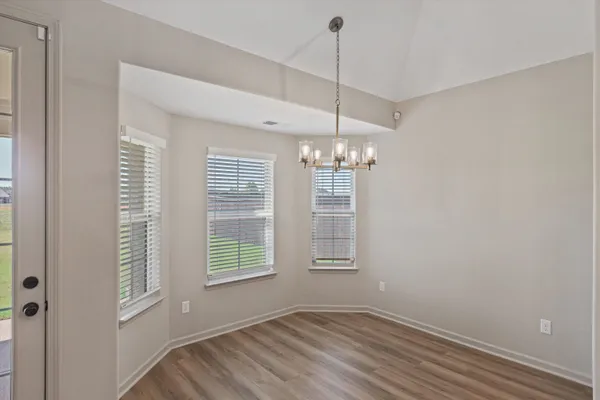 a view of kitchen with sink and wooden floor