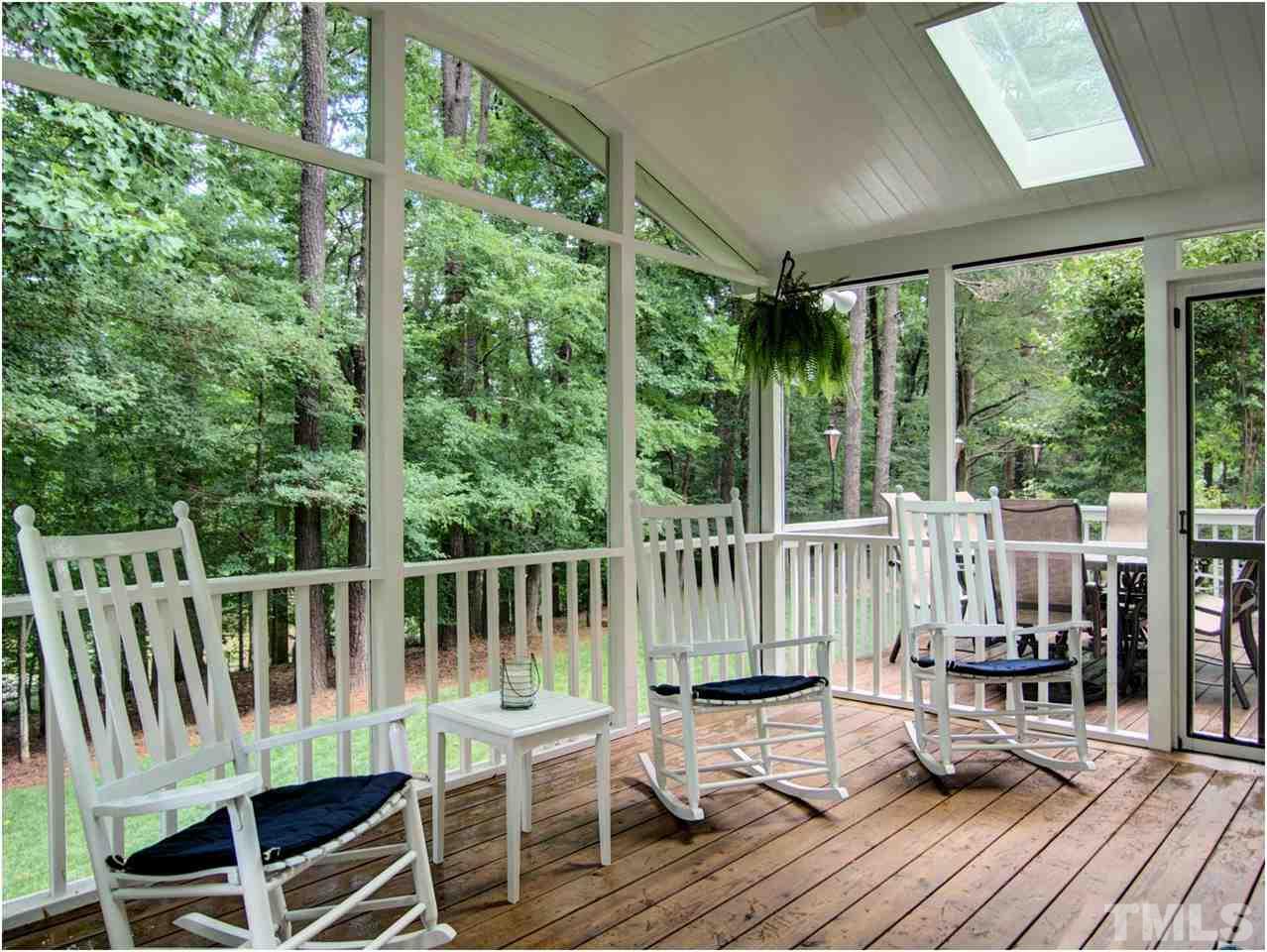 9021 Hemingwood Court Raleigh, NC 27613 - Photo 22 of 25 a view of a chair and table on the deck