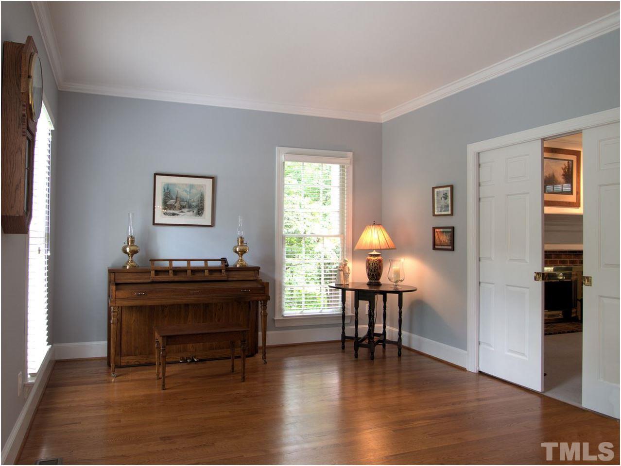 9021 Hemingwood Court Raleigh, NC 27613 - Photo 5 of 25 a living room with furniture and wooden floor