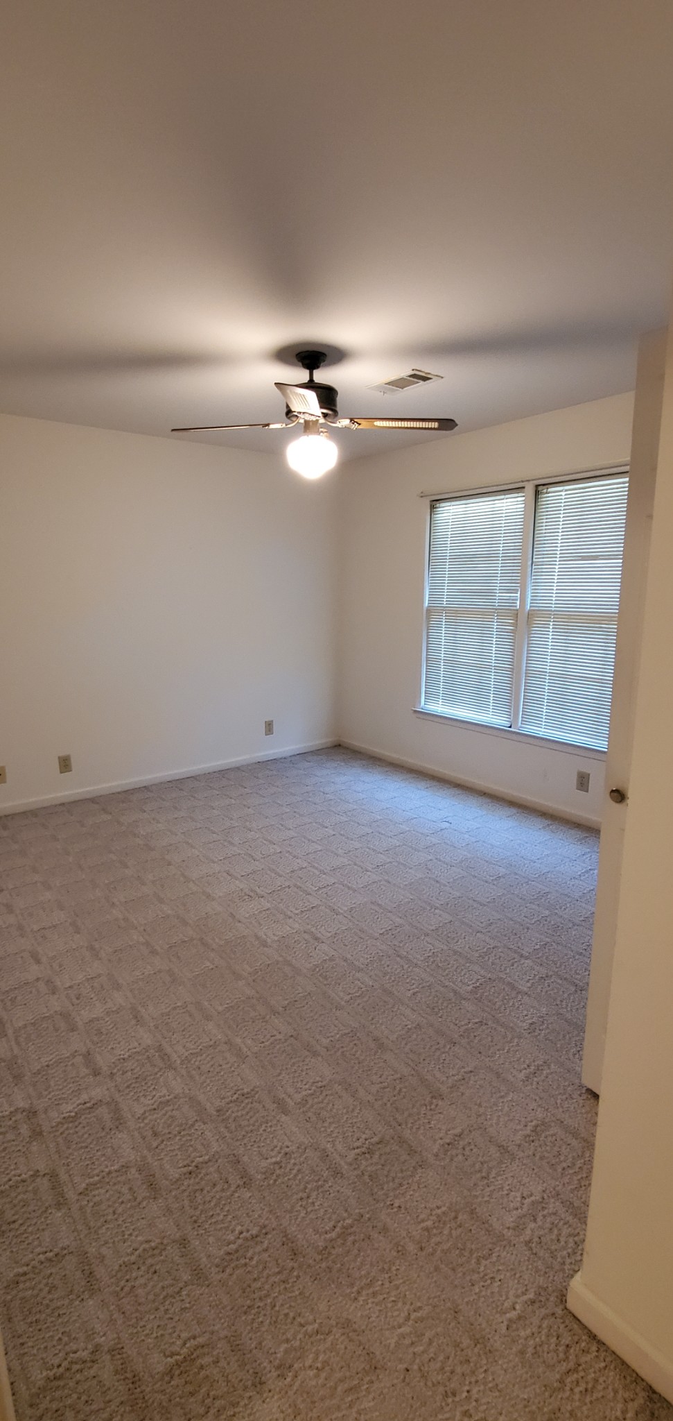 716 Kent Road Nashville, TN 37214 - Photo 11 of 15 an empty room with windows and fan