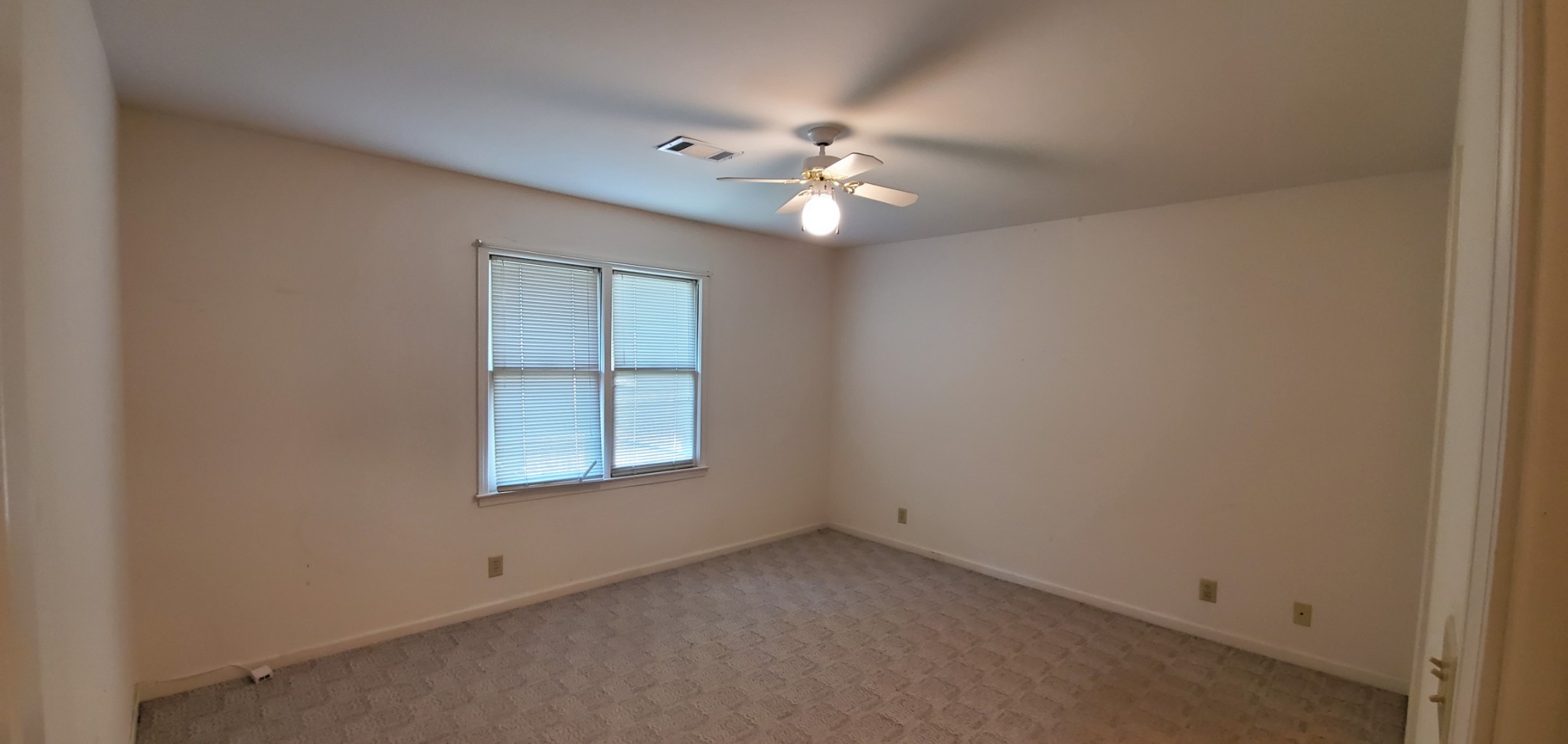 716 Kent Road Nashville, TN 37214 - Photo 13 of 15 an empty room with a window and a fan