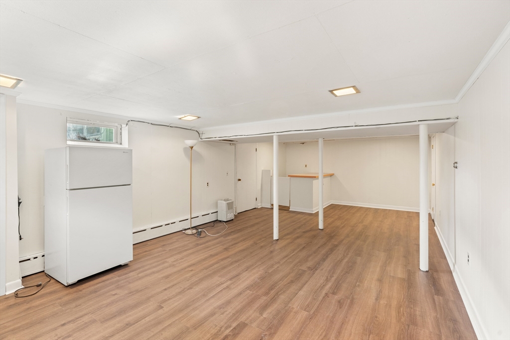10 Dulgarian Terrace, Unit 10 Chelmsford, MA 01824 - Photo 17 of 18 a view of empty room with wooden floor