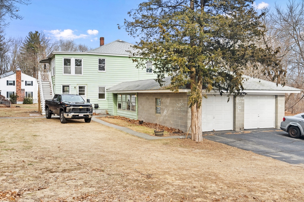 10 Dulgarian Terrace, Unit 10 Chelmsford, MA 01824 - Photo 18 of 18 a view of a house with a large tree