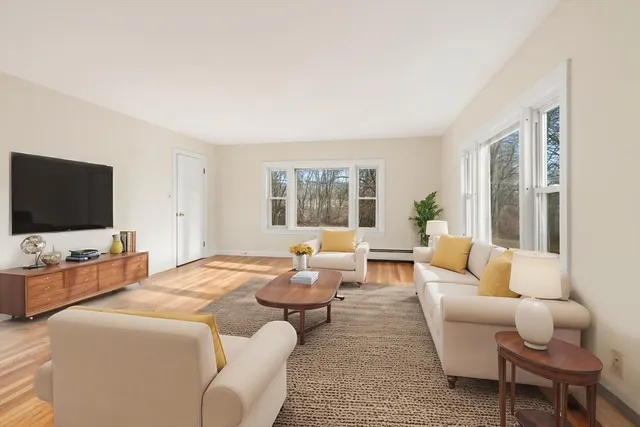 a bedroom with furniture and a flat screen tv