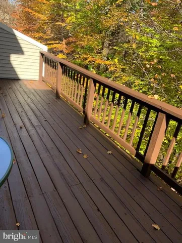 a view of balcony with wooden floor