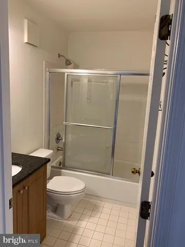 a bathroom with a toilet a sink and shower