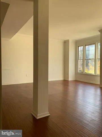 a view of a livingroom with wooden floor