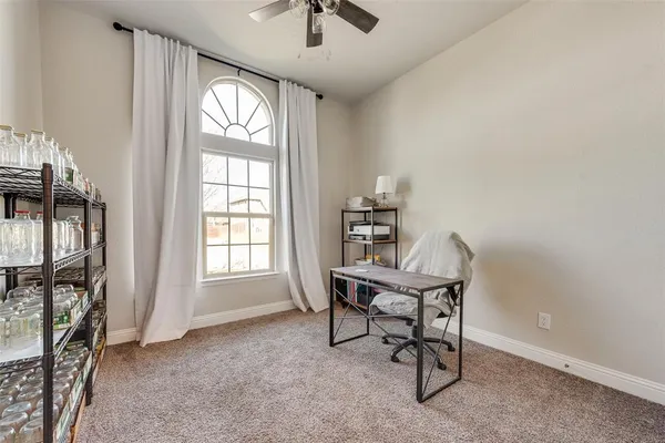 a workspace with furniture and a window