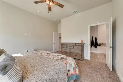 a bedroom with a bed and a cabinets