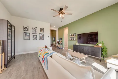 a living room with furniture and a rug